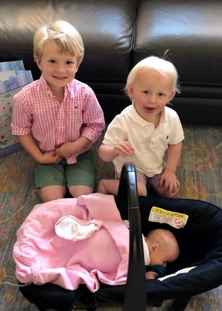 two brothers with baby sister